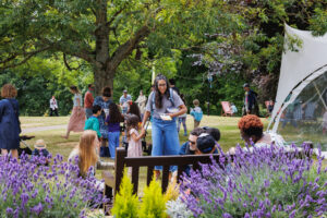 A family day in a park with lavendar bushes in the foreground