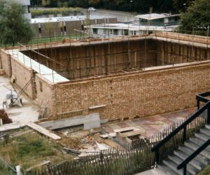 Outer walls of a square building being built on highfield campus