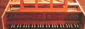 The keyboard and part of the lid of an antique harpsichord